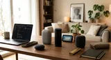 Modern workspace with smart speakers on a minimalist desk, ambient lighting, neutral tones, and a cozy living room backdrop.